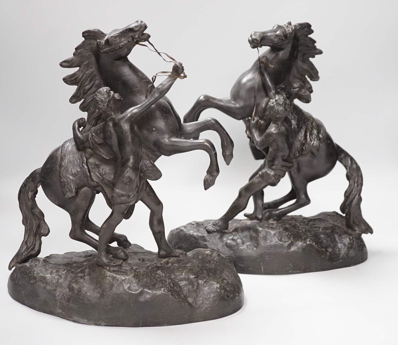 A pair of spelter Marley horses, 31cm